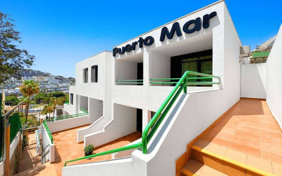 01 Puerto Mar Apartments in Puerto Rico Main Entrance Front View of Holiday Rental Complex in Gran Canaria with Clear Sky scaled 6600ce41